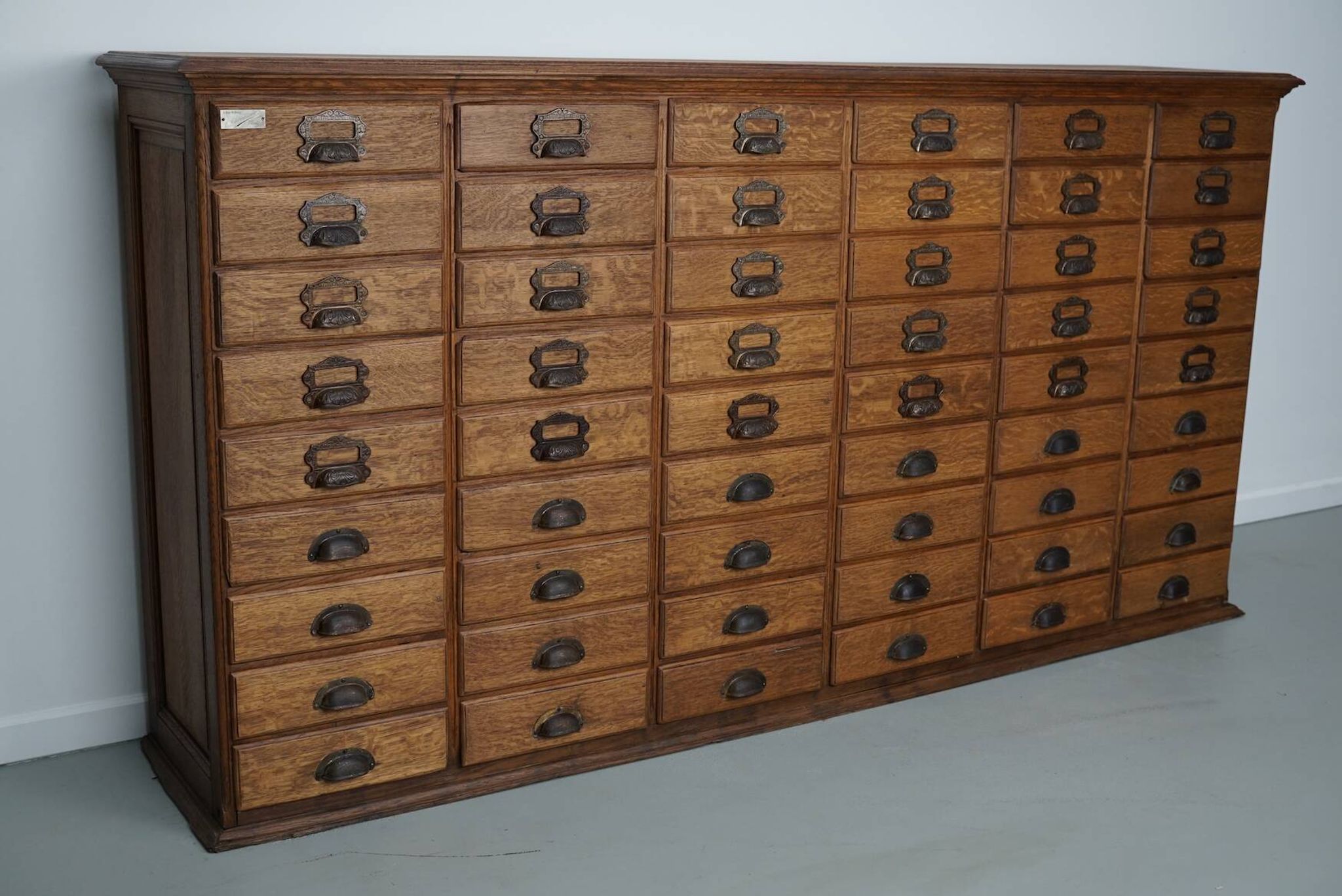 Antique French oak filing / apothecary cabinet by Chouanard, ca 1910