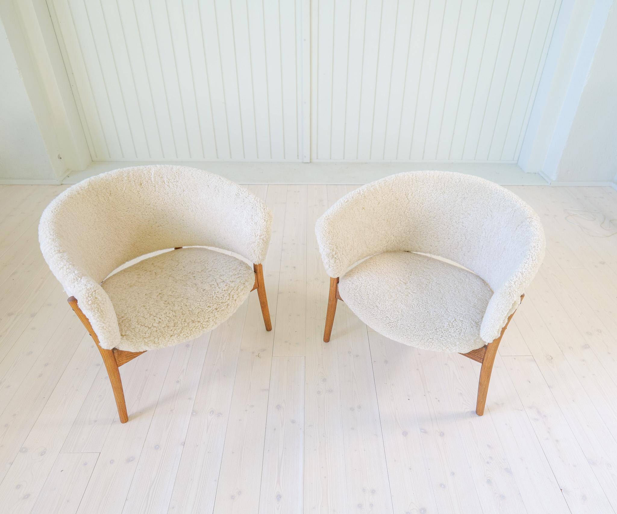 Mid-century lounge chairs in sheepskin/shearling and stained wood, Sweden, 1962.