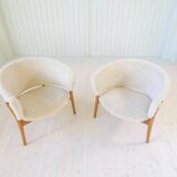 Mid-century lounge chairs in sheepskin/shearling and stained wood, Sweden, 1962.