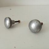 Pair of antique solid aluminium furniture handles.
