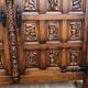 Spanish furniture with carved wood profiles and coats of arms from the 1950s.