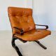 Vintage Scandinavian cognac lounge chair by Oddvin Rykken