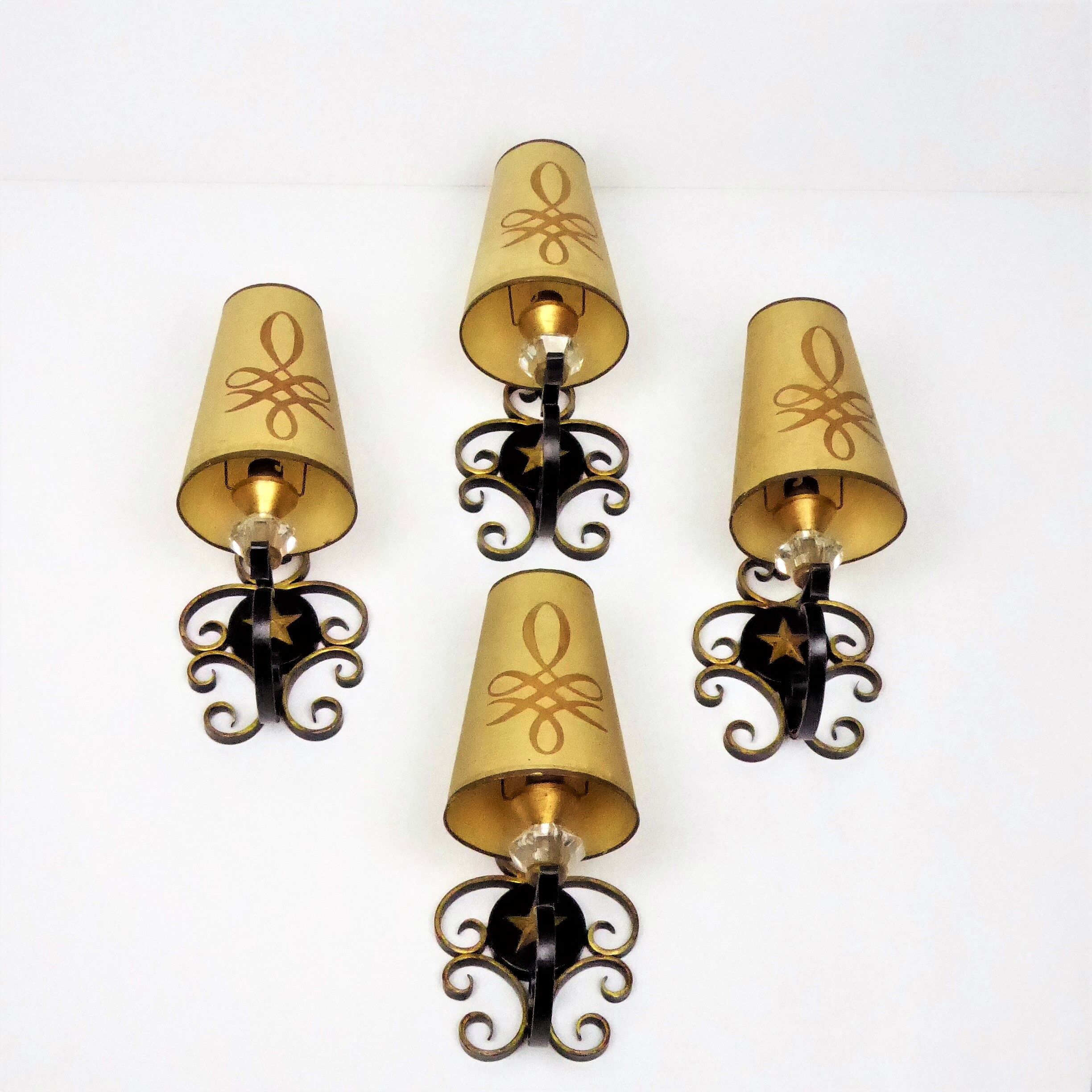 1950 gold star and black metal sconces