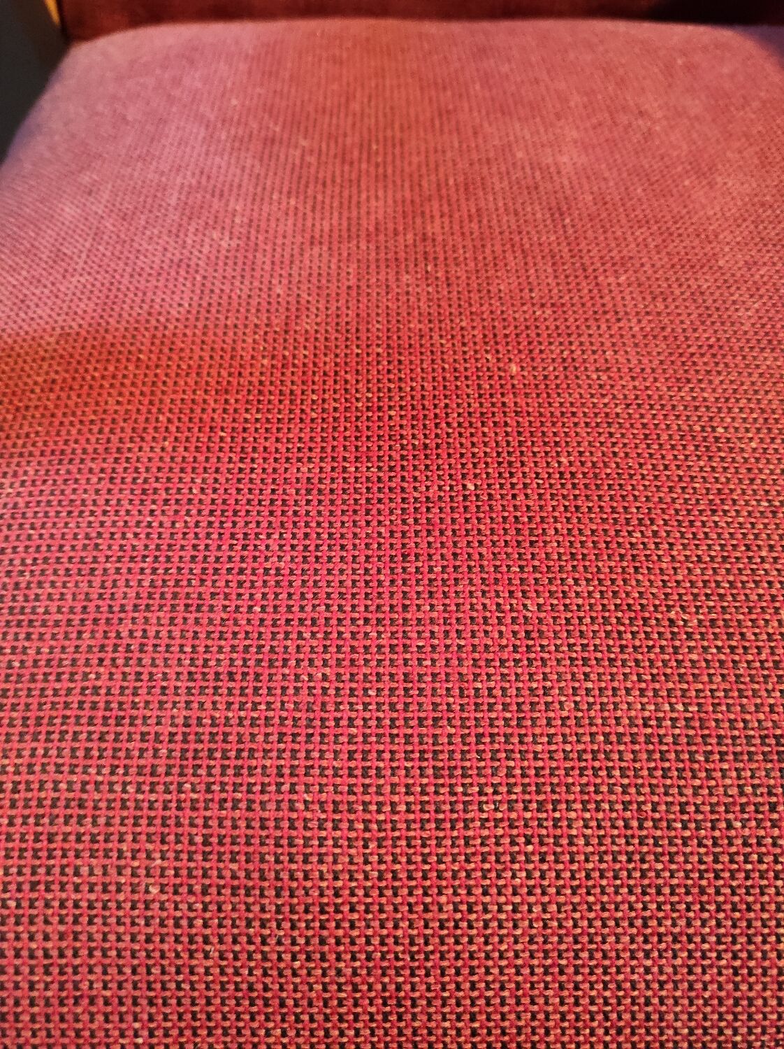Vintage red armchair with compass feet in Scandinavian design