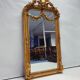 Miroir baroque doré avec guirlande de fleurs