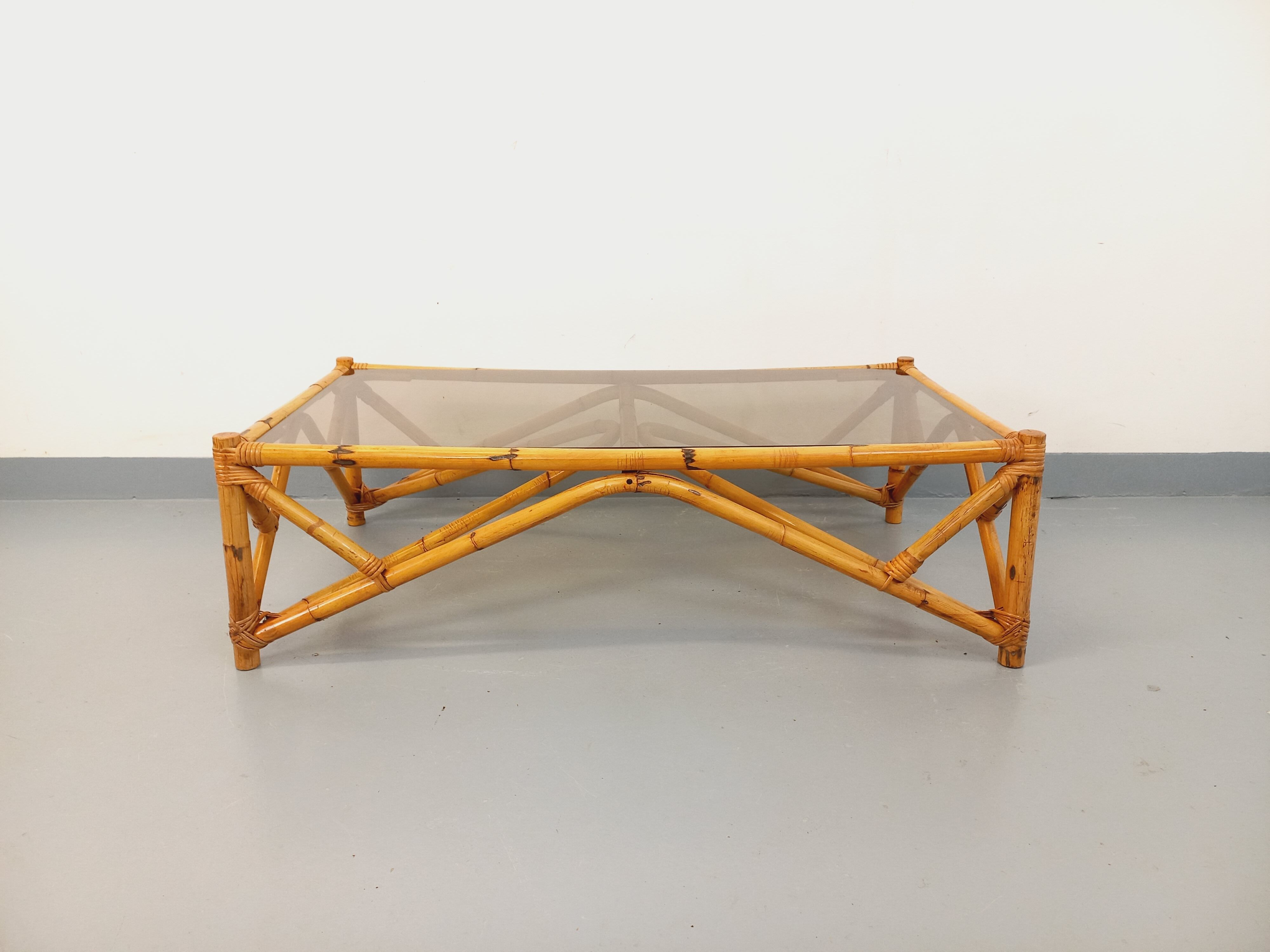 Vintage rectangular coffee table in rattan and smoked glass from the 1970s.