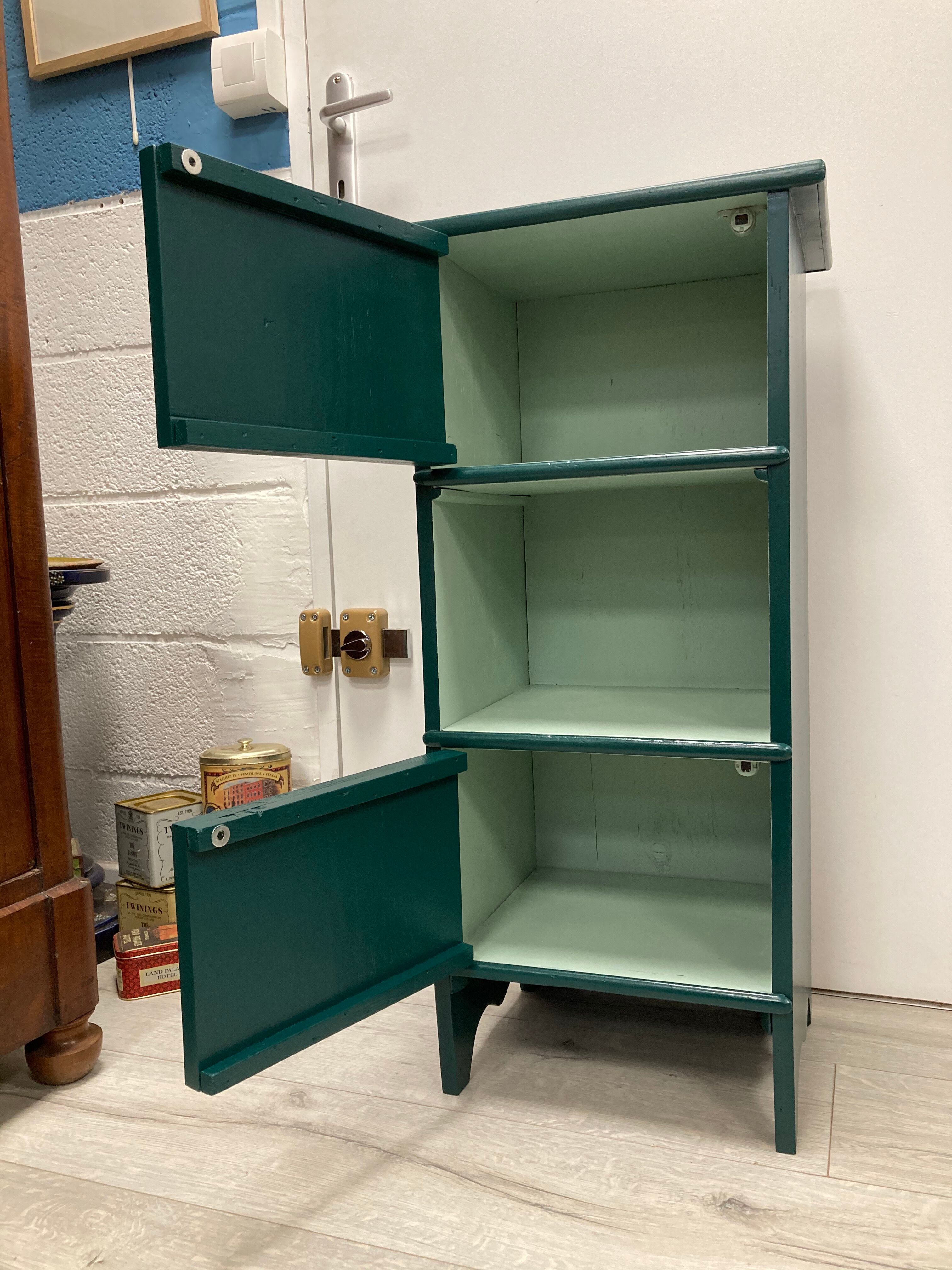Two-door green bedside table