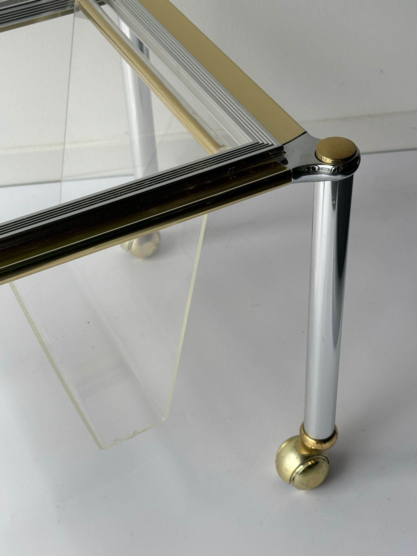 Magazine rack in Plexiglas and gold and chrome metal, 1970