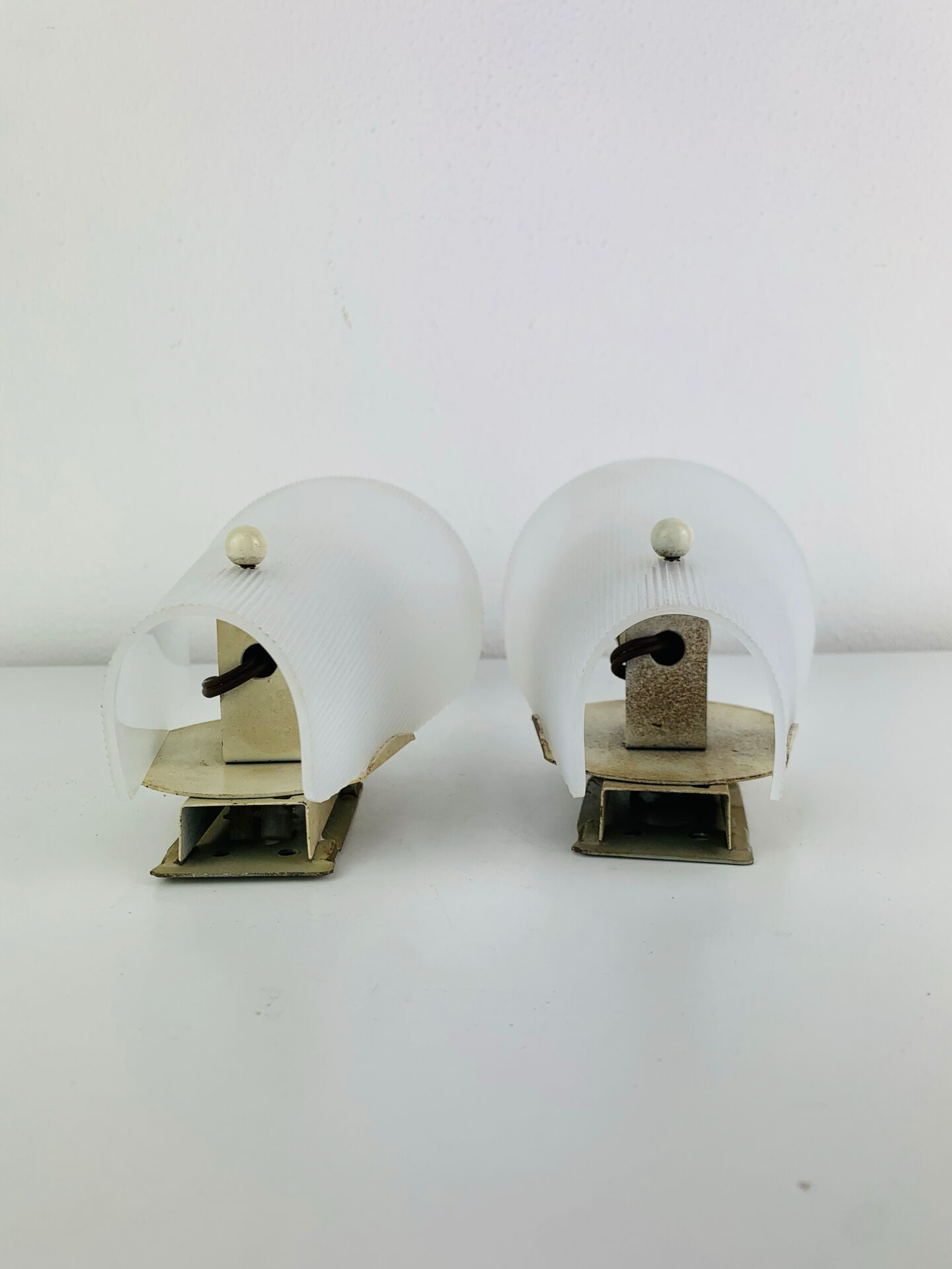 Pair of 1950s striped plastic wall lights.