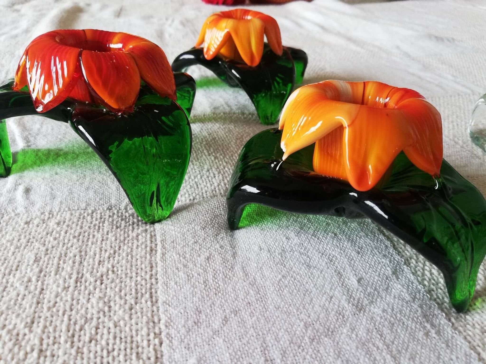 Lot of three Murano flower candle holders.