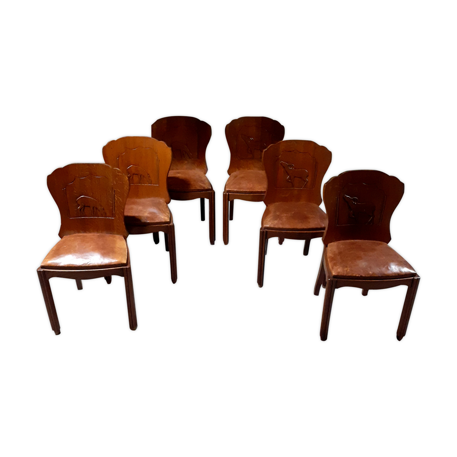 Set of 6 vintage solid wood chairs with animal motif on the back and leather seat