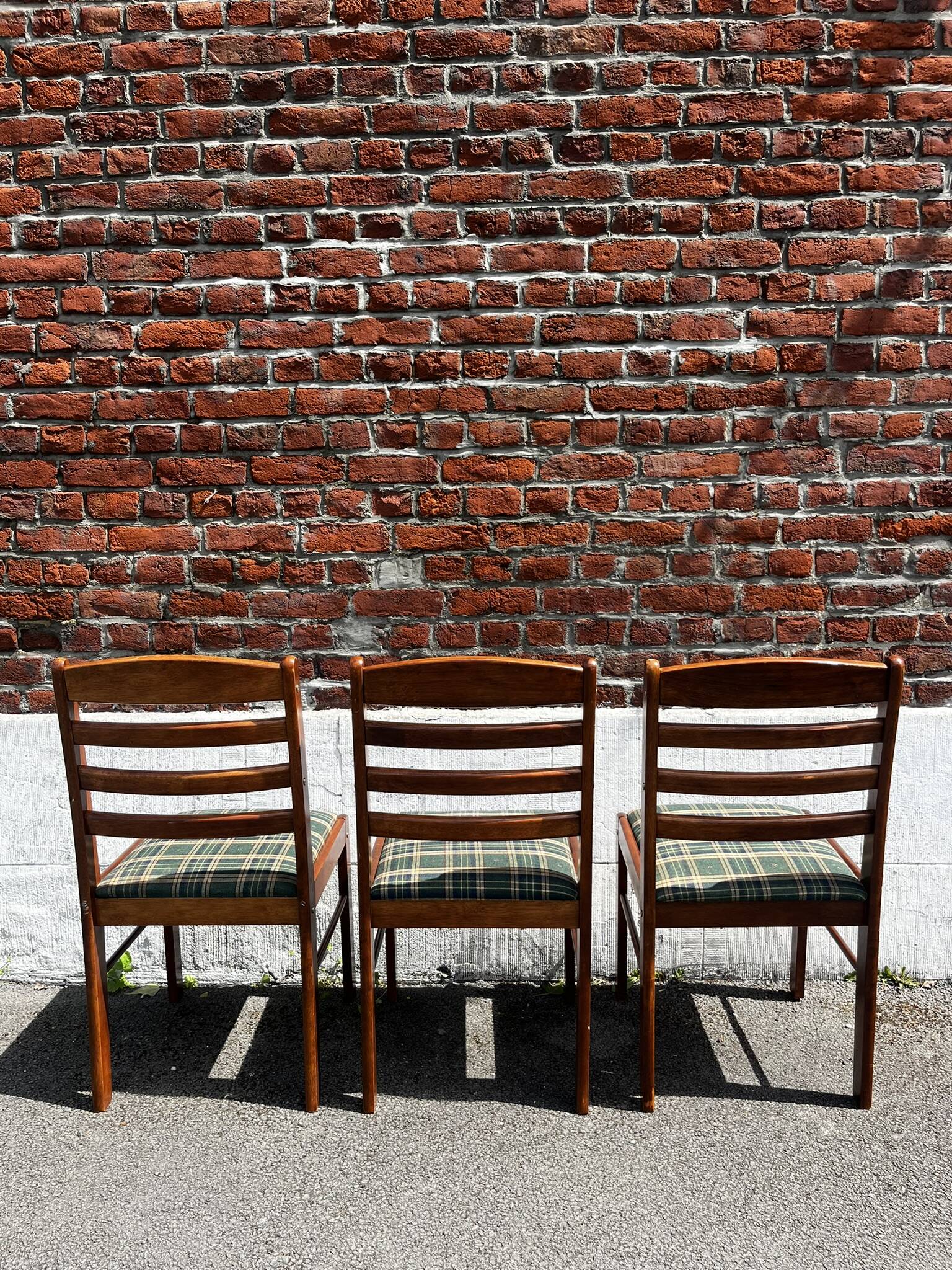 Lot of 3 vintage checkered wood and fabric chairs.