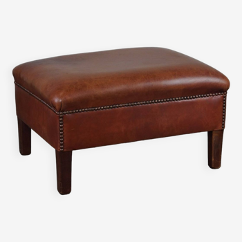 Leather ottoman in classic English style finished with decorative nails