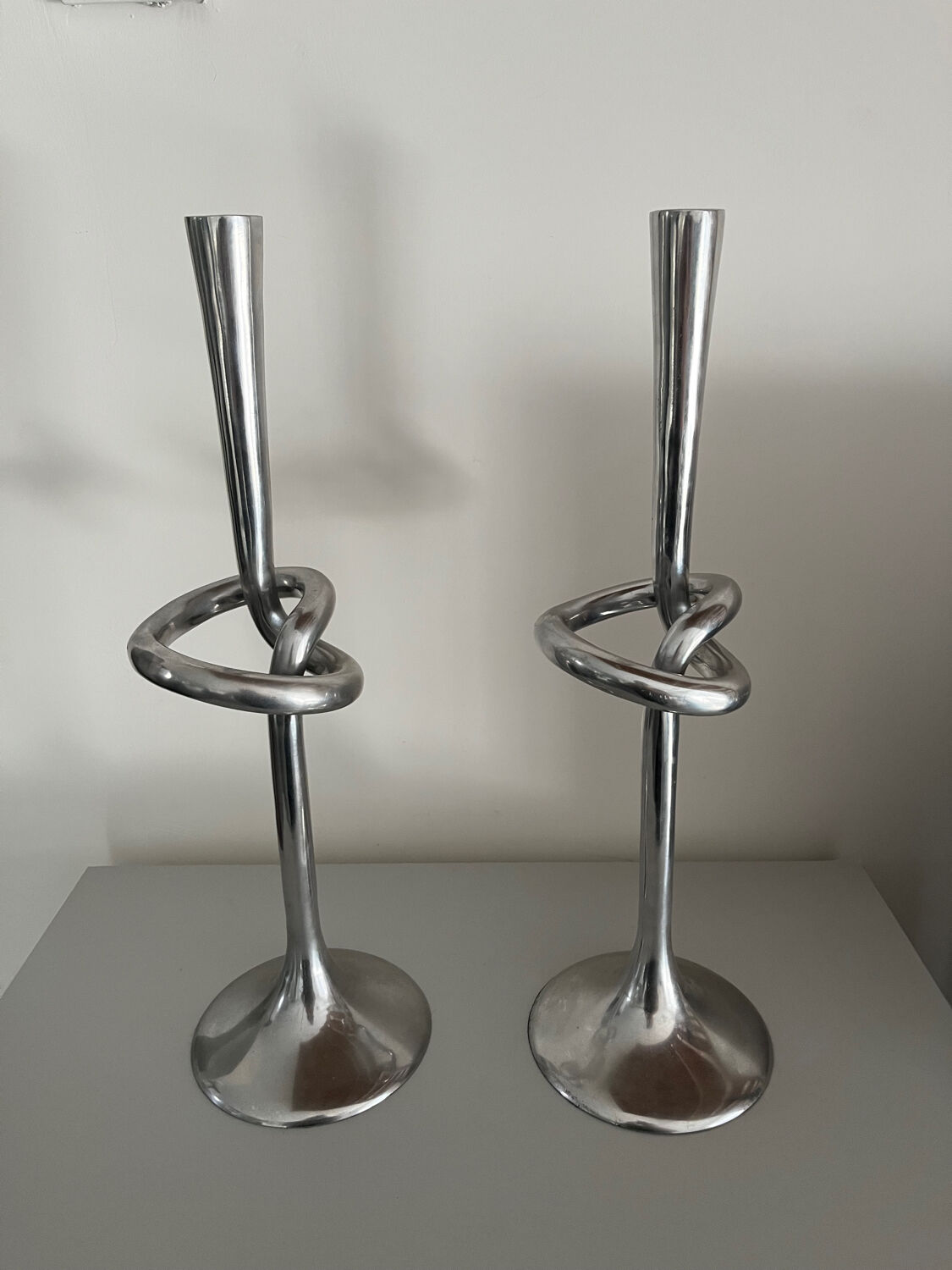 Pair of large kare design cast aluminum candlesticks