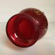 Cameo vase and red cabochons in burgundy glass
