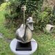 Old vintage lamp representing a duck in silver metal with wooden base