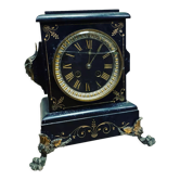 Horloge en marbre noir et ornement en laiton