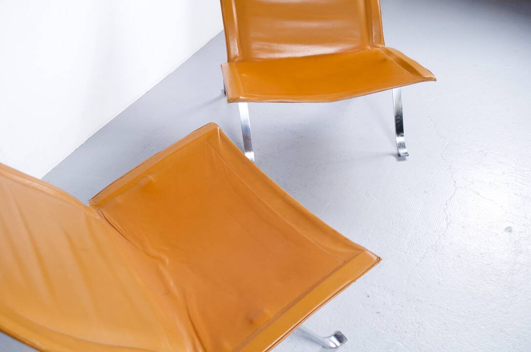 Imposing pair of leather and steel armchairs from the 1960s