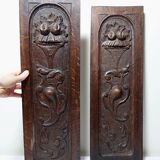 Pair of decorative wall panels in carved wood from the 19th century.