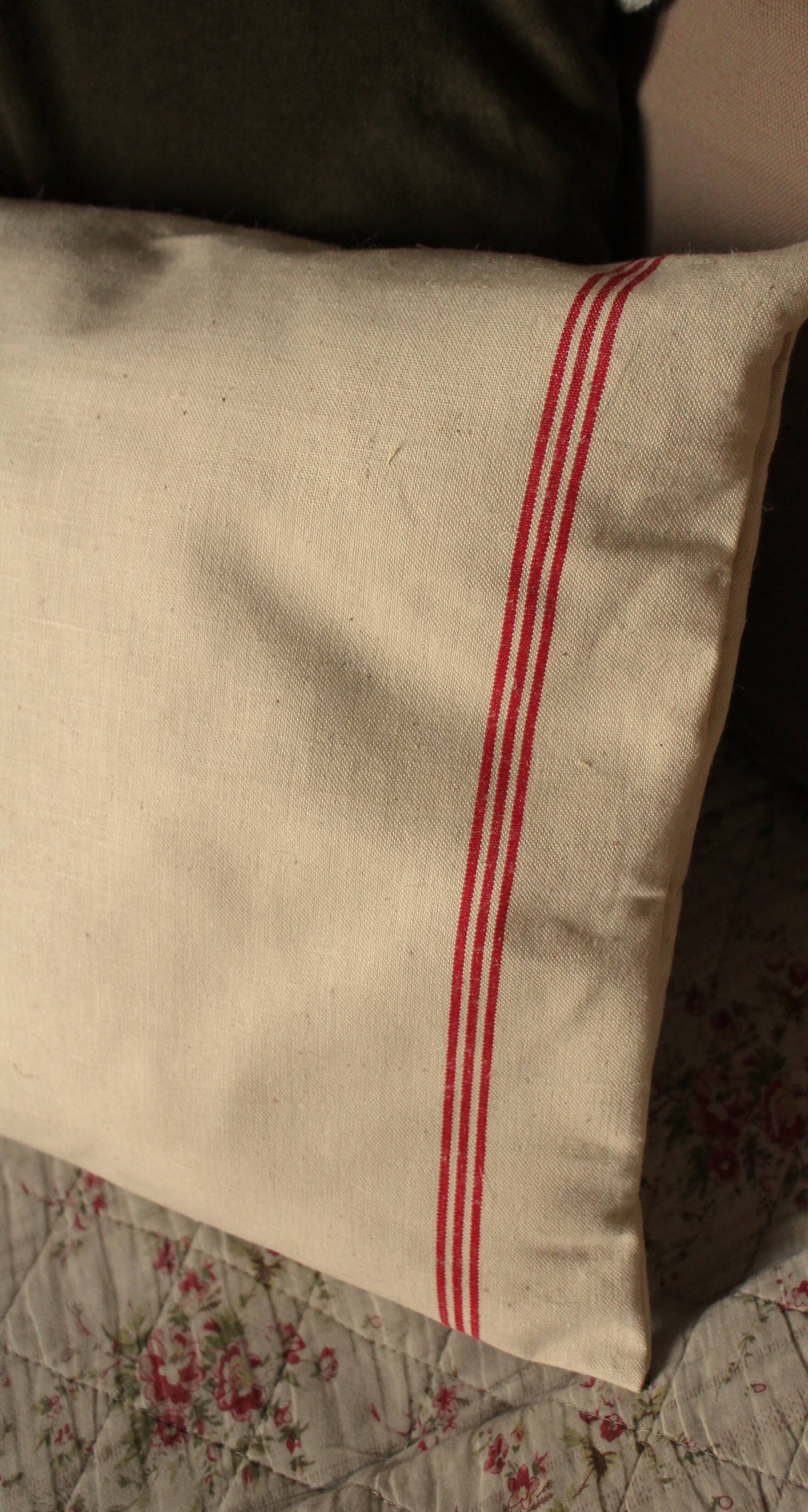 Old red striped Torchon cushion