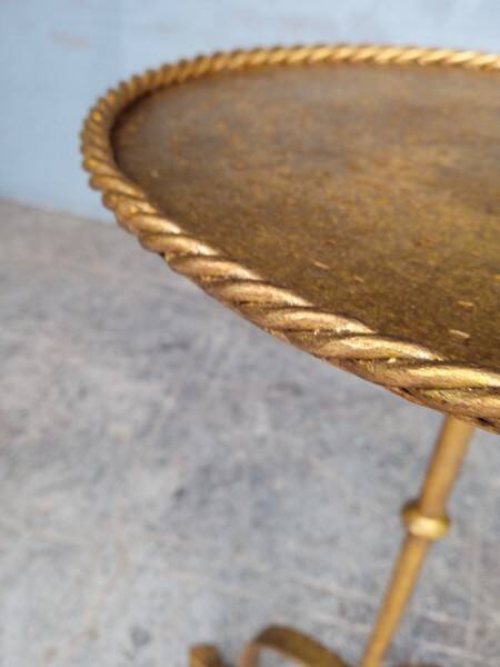 Minimalist brutalist gold metal pedestal table