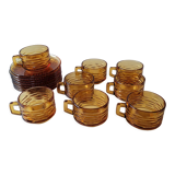 Set of 8 cups and amber glass under cups