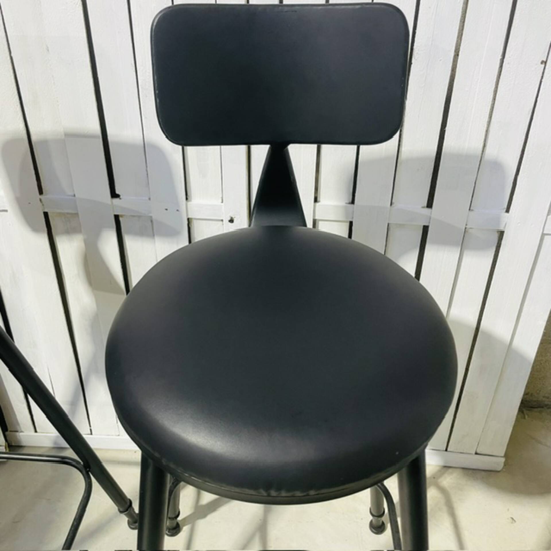 Pair of black bar stools in industrial and contemporary style.