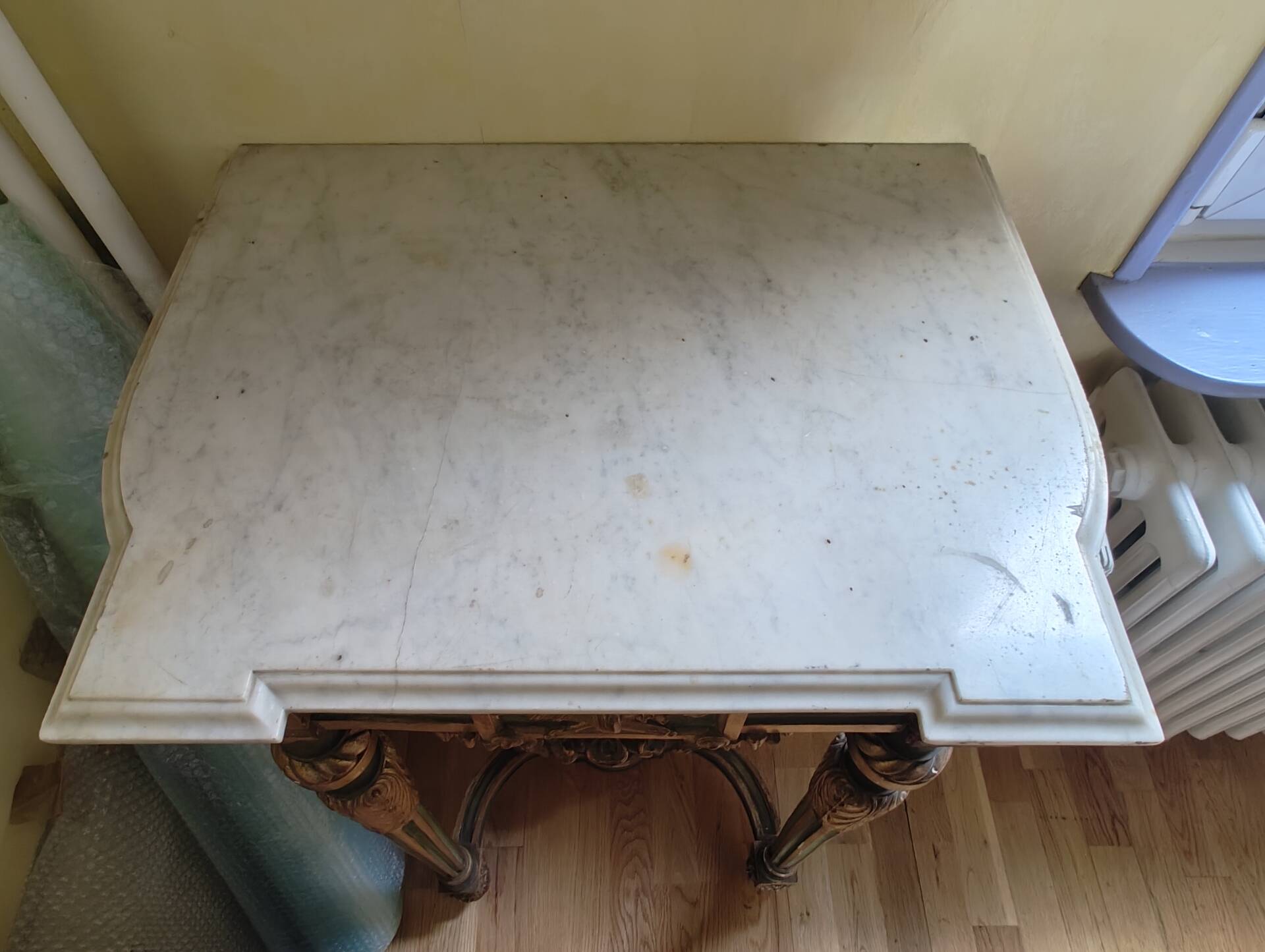 Golden wood and marble console in neoclassical style