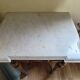 Golden wood and marble console in neoclassical style