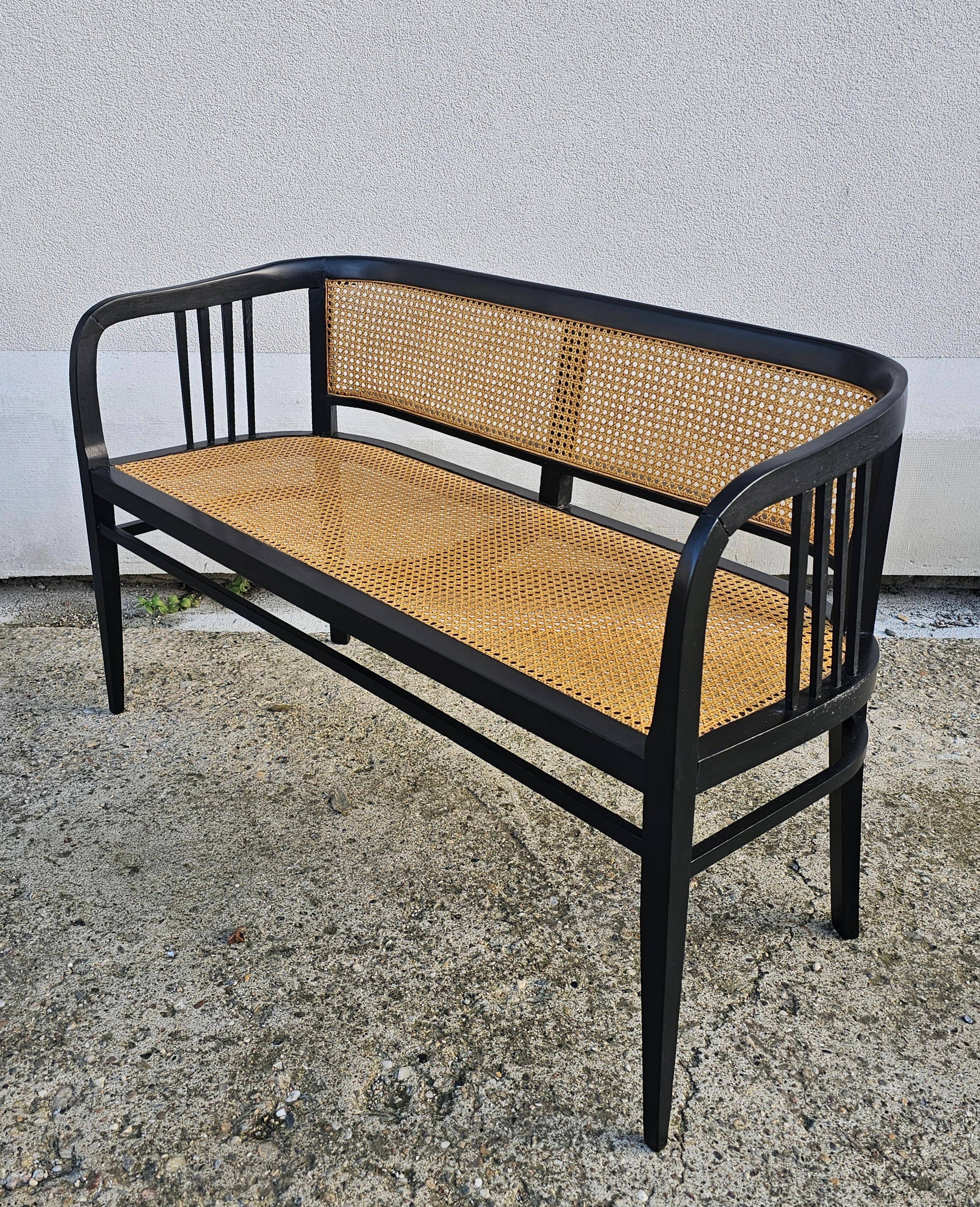 Vienna Secession beech canapé with cane seat and backrest.