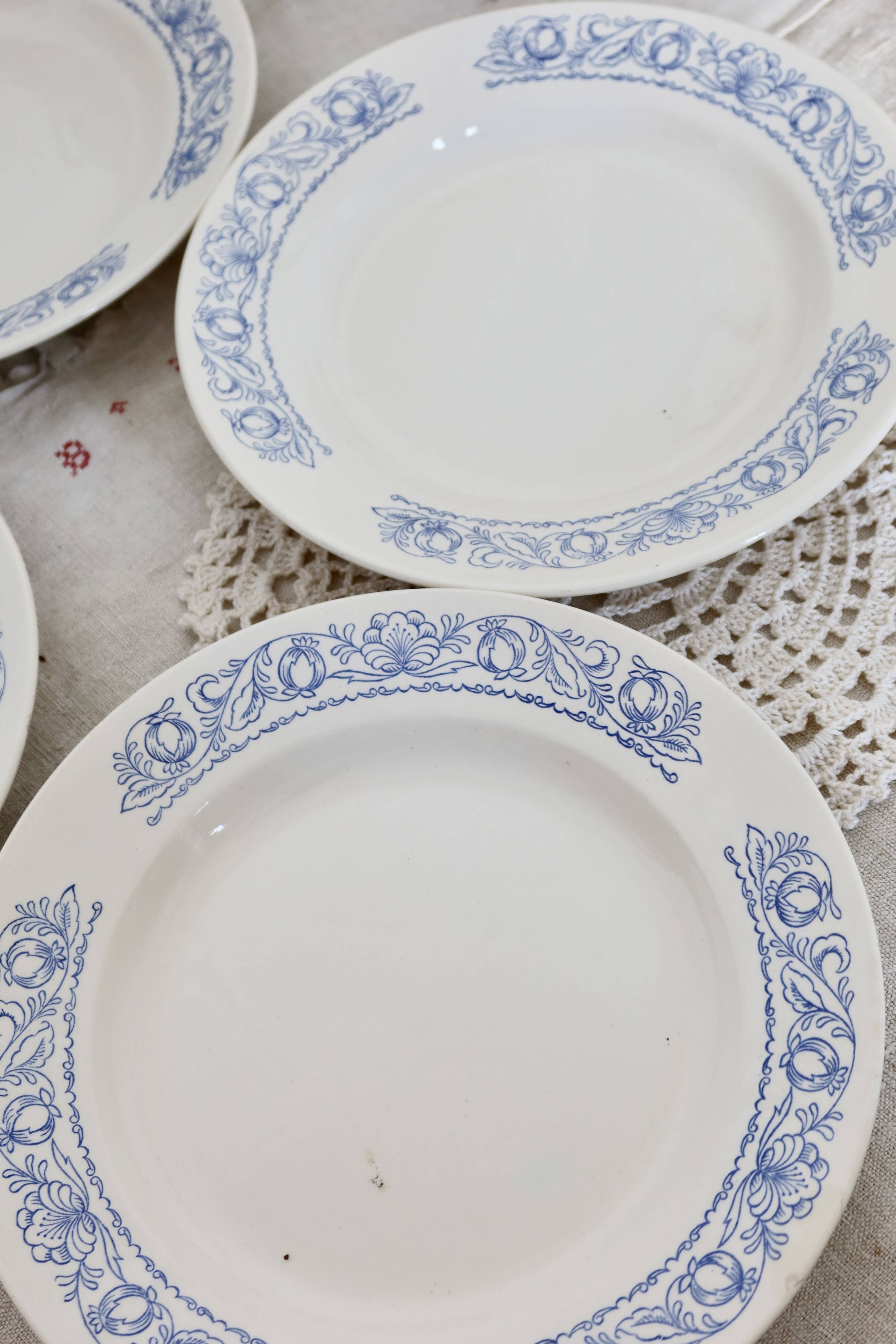 4 vintage white soup plates with blue border