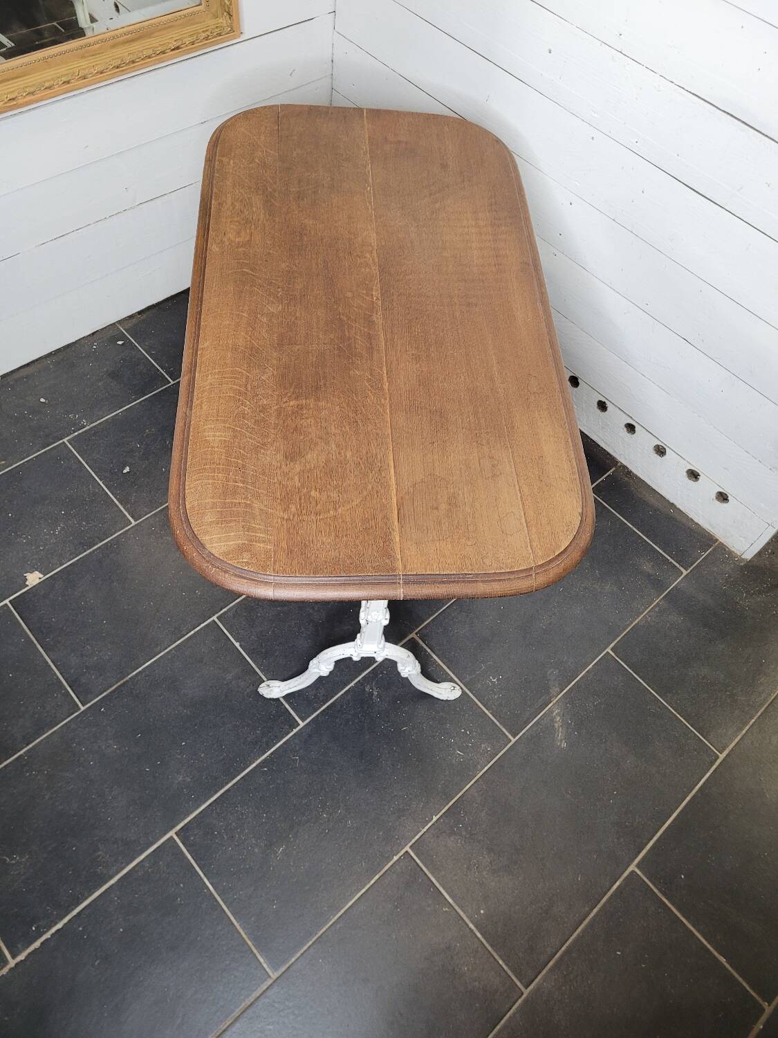 Bistro table with cast iron base and oak top