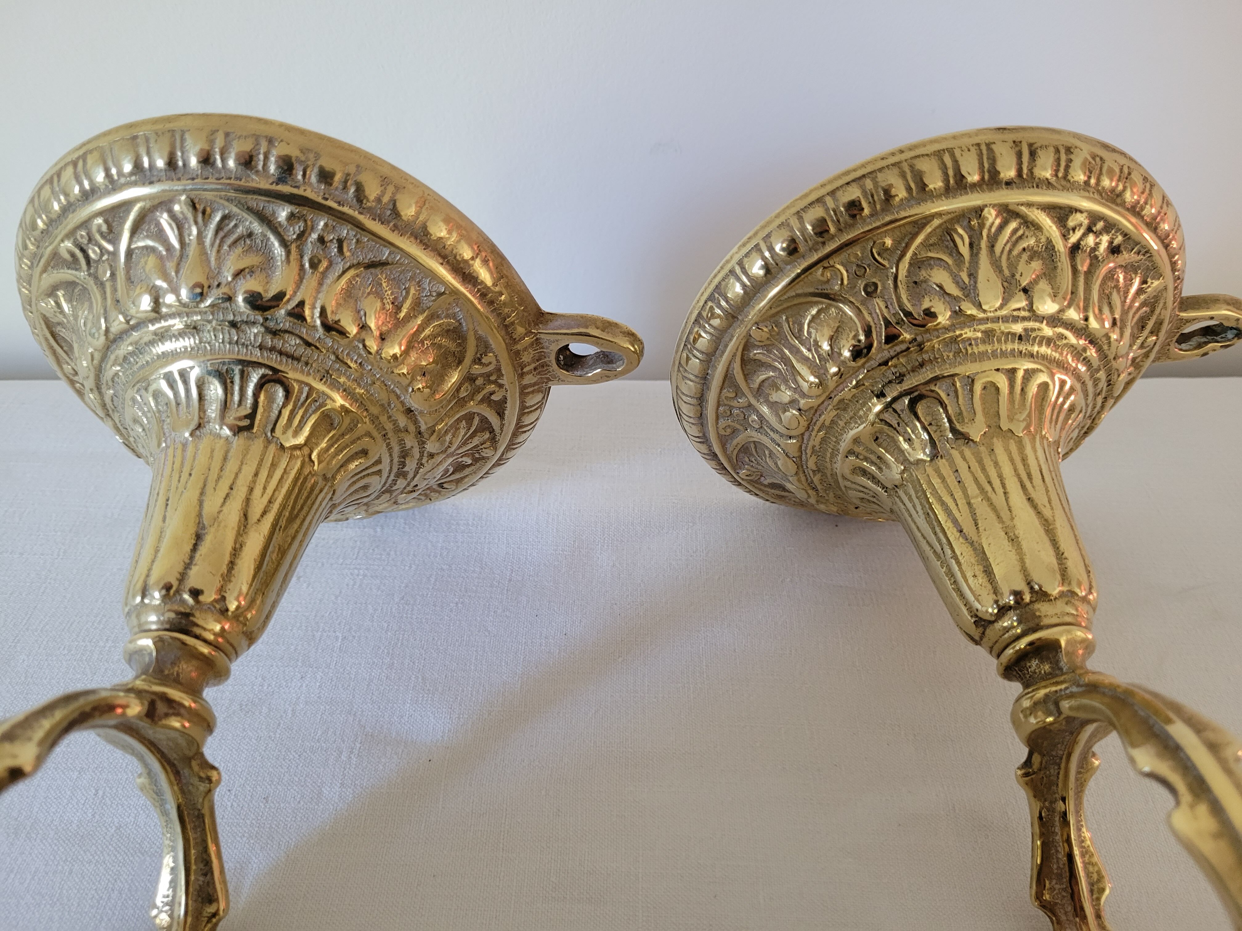 Duo of brass balance wall candle holders
