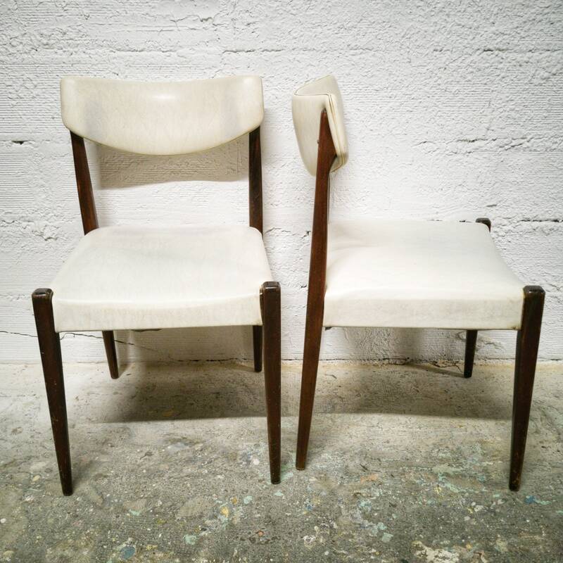 Pair of vintage teak and skai chairs