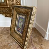 Oriental engraving with its gilded frame