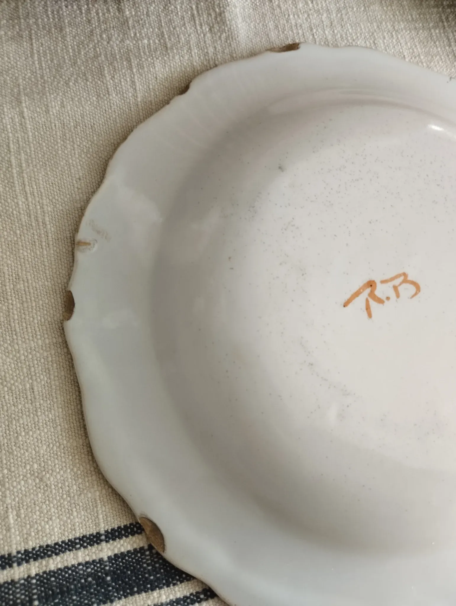 Pair of antique plates with a bird of paradise design in the style of Moustiers.