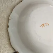 Pair of antique plates with a bird of paradise design in the style of Moustiers.