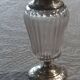 Crystal and solid silver shaker, neck brace and master's mark.