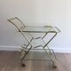 Italian designer rolling table in brass and engraved glass