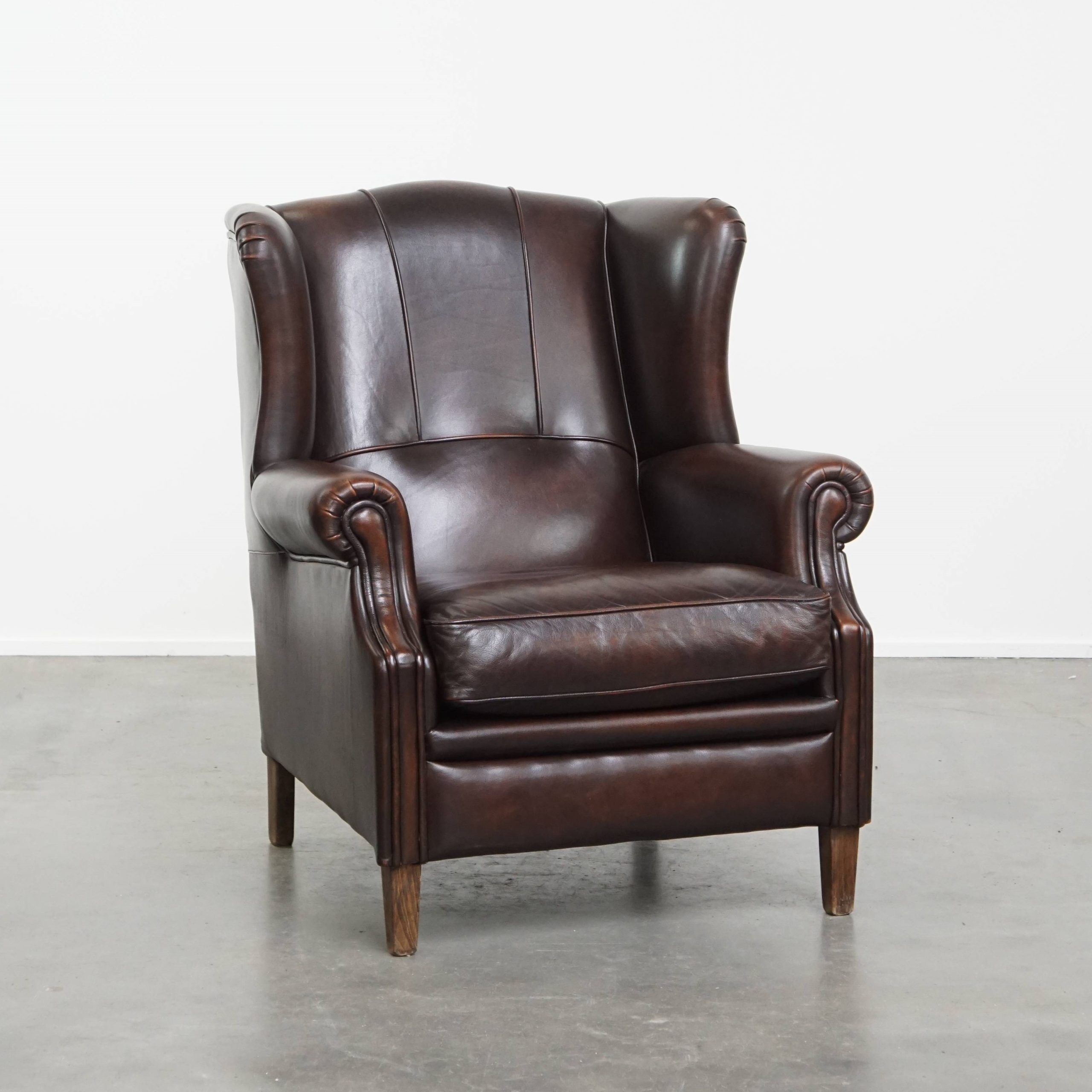Very beautiful wing chair made of cowhide leather in English style