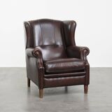 Very beautiful wing chair made of cowhide leather in English style