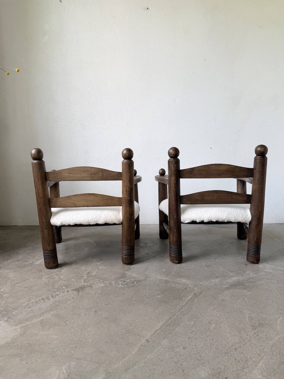 Pair of Dudouyt armchairs from the 1950s, oak.