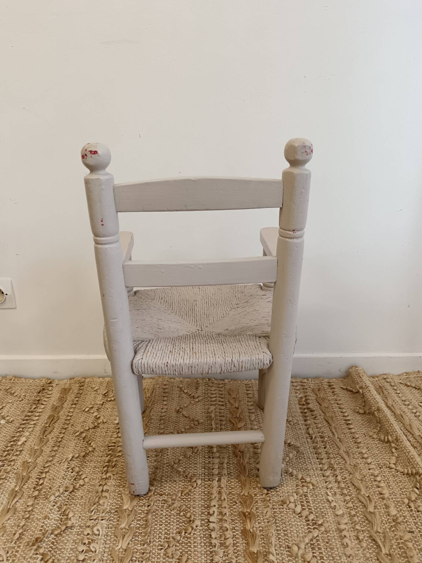 Grey patinated children's armchair with straw seat