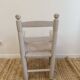 Grey patinated children's armchair with straw seat