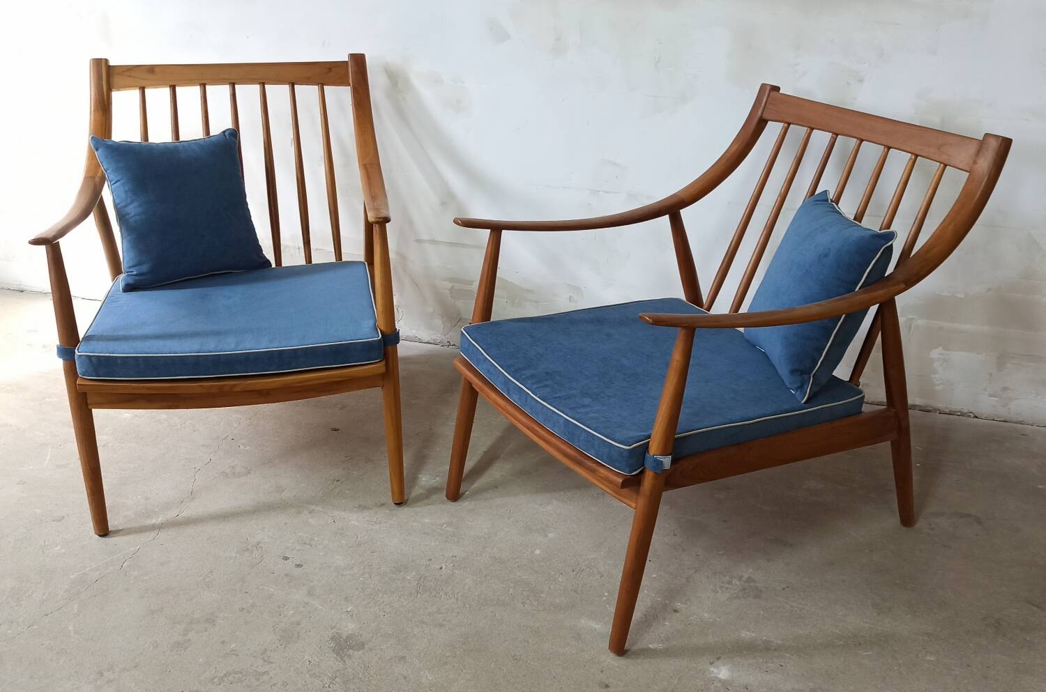 Pair of cozy teak armchairs with cushions