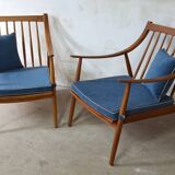 Paire de fauteuils cosy en teck avec coussins
