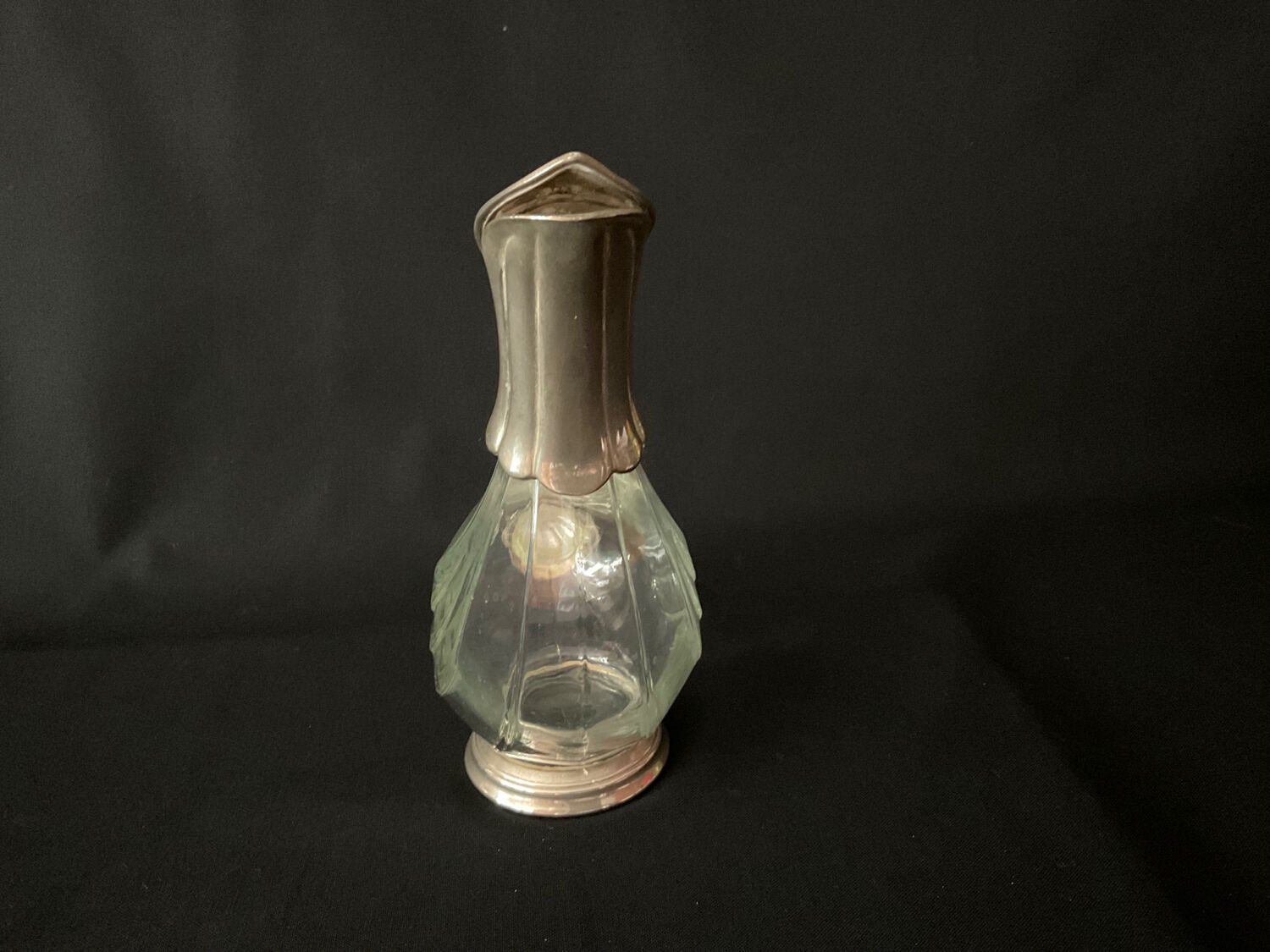 Glass decanter and silver metal duck