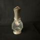 Glass decanter and silver metal duck
