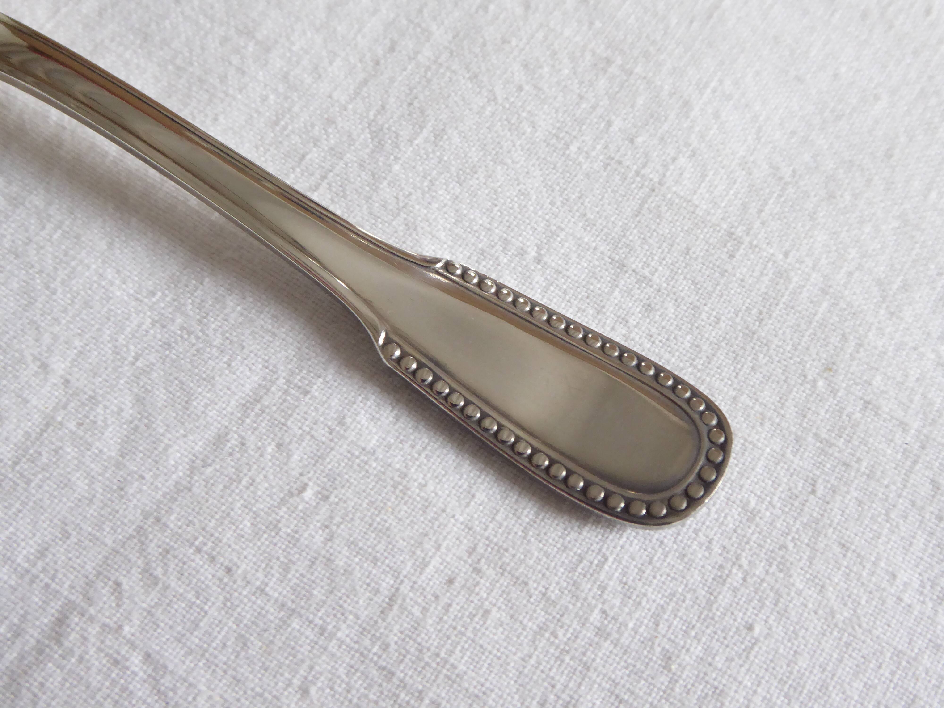 Cockerel + silver metal spoon