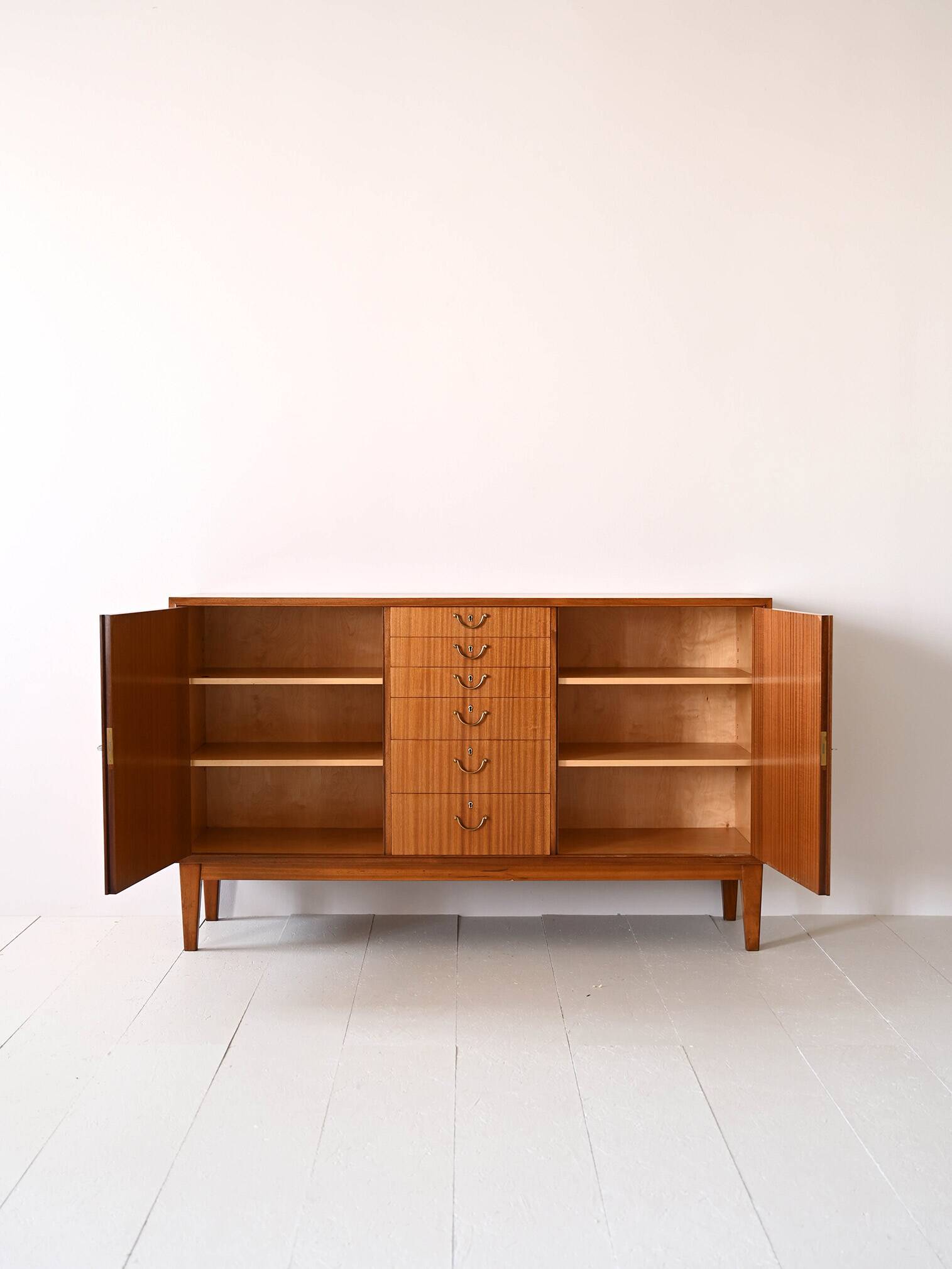Scandinavian high sideboard with central drawers